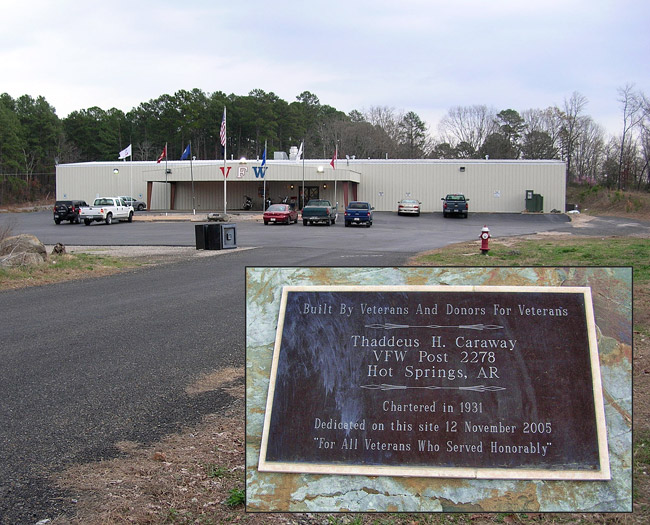 Single-story V. F. W. building with covered entrance on parking lot with plaque in second image