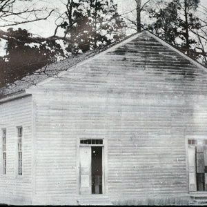 Single-story wooden church building with two front entrances