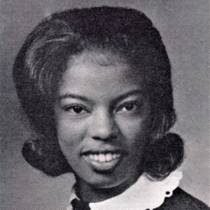 Young African-American woman smiling in collared shirt