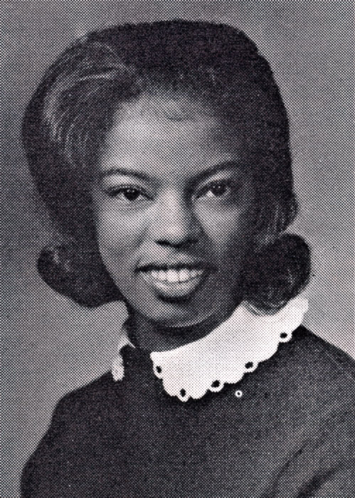 Young African-American woman smiling in collared shirt