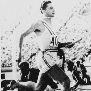 White man running in Olympic uniform with number "40" on his chest
