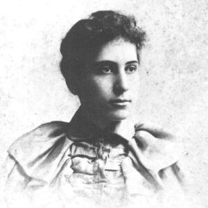 Young white woman with dark hair wearing a formal dress