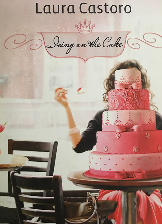 White woman sitting behind multi-tier wedding cake under "Icing on the Cake" title on book cover