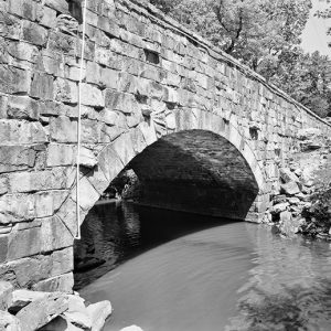 Stone arch bridge over creek