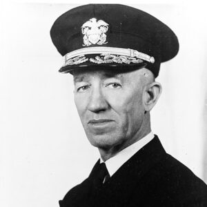White man in military uniform with cap