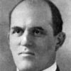 Balding white man in suit and tie