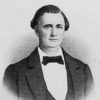 White man in suit and bow tie