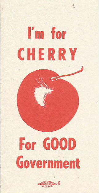 Red cherry and text on ribbon