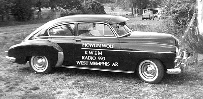"Howling Wolf" car with radio advertisement on its doors