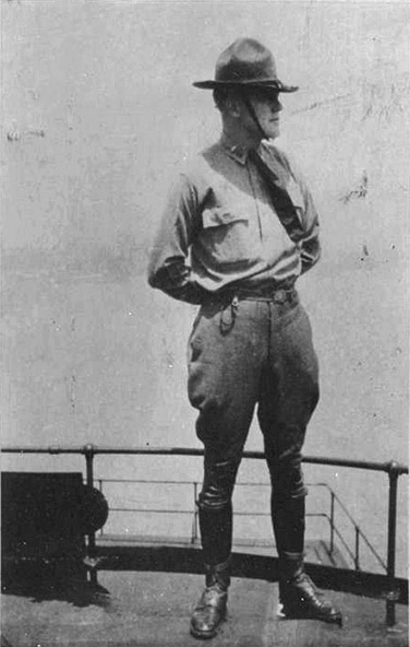 White man standing in hat and uniform