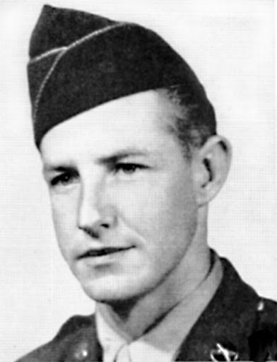 Young white man in military uniform with cap