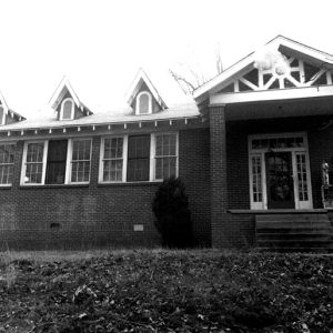 Brick school building with covered porch