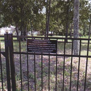 Iron fence with "Cleburne Farm Cemetery Preservation Program 2017" plaque on it