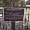 "Cleburne County Farm Cemetery National Register of Historic Places 2005" plaque on iron fence