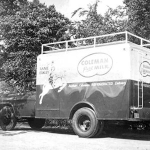Side view of a Coleman Dairy truck with Annie Oakley design on it