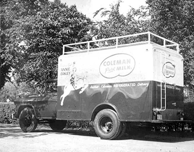 Side view of a Coleman Dairy truck with Annie Oakley design on it