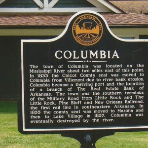 "Columbia" historical marker sign and house behind it