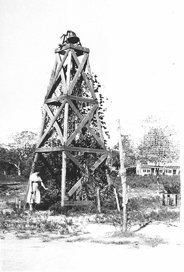 White woman and wooden bell tower