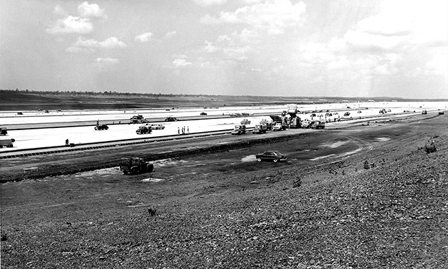 Vehicles on unfinished air strip