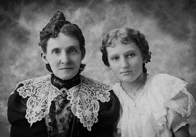 Older white woman and younger white woman in dresses with lace collars