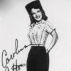 Photo of white woman in cowboy hat and western clothing signed "Carolina Cotton" in cursive handwriting