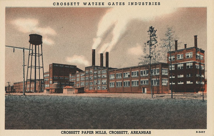 Postcard featuring large industrial buildings with smokestacks and water tower
