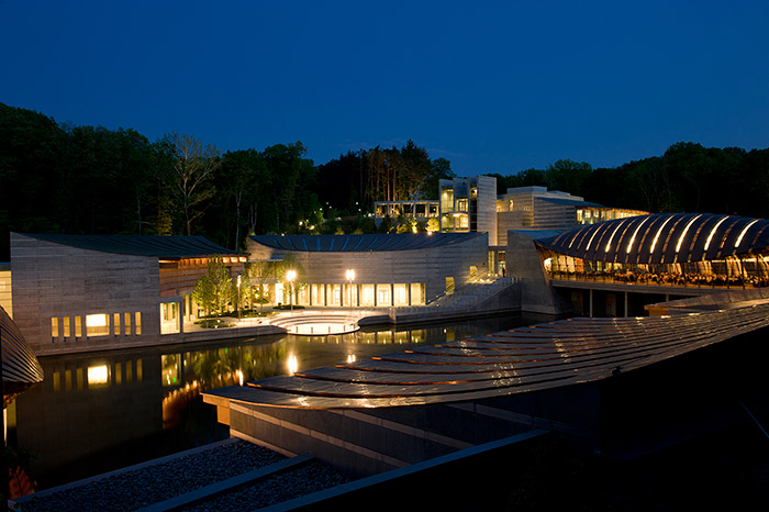 Modern building with reflecting pool at night