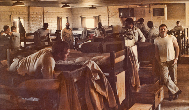 White prisoners in room with bunk beds