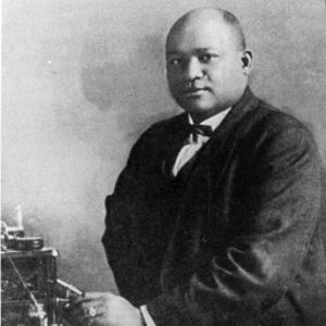 Bald African-American man in suit and tie