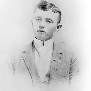 Young white man in suit and tie