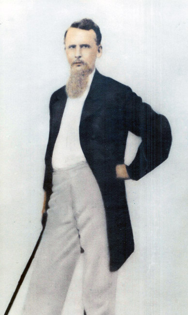 Portrait white man short hair long beard long jacket hand on hip contrapposto pose