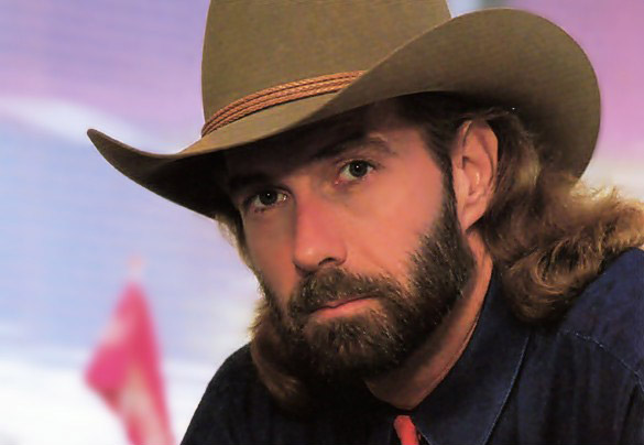 White man with long hair and beard in cowboy hat