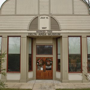 Single-story building with tall windows and double doors "Delta Area Museum"