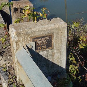 "Departee Creek Relief 1976" plaque on bridge