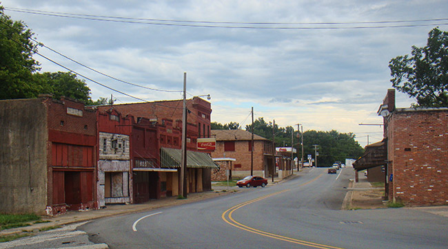 Street with brick storefronts on both sides