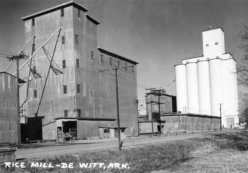 Multistory industrial buildings and silos with power lines