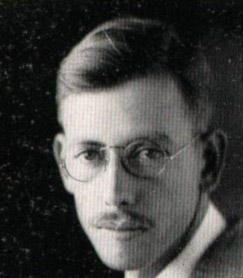 White man with round glasses