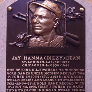 Bust of white man in baseball cap on "Jay Hanna (Dizzy) Dean" plaque