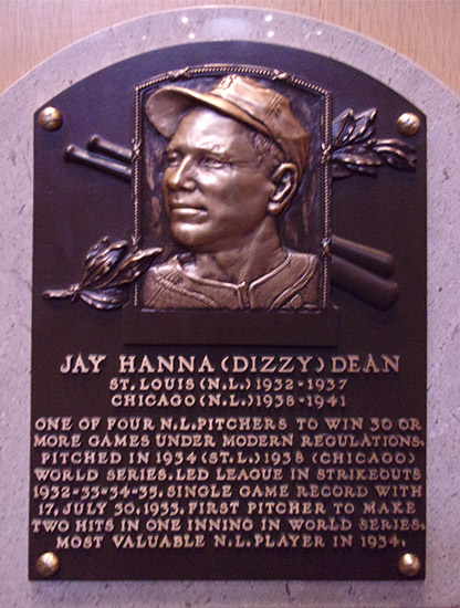 Bust of white man in baseball cap on "Jay Hanna (Dizzy) Dean" plaque