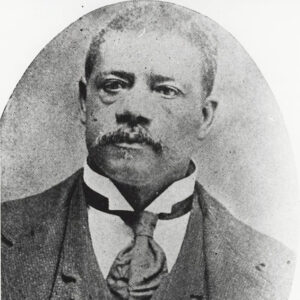African-American man with mustache in suit and tie in oval frame