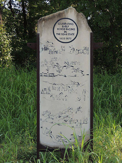 "Celebrating early horse racing in the Bear State 1835 to 1875" stone monument with horse drawings on it