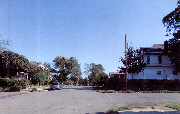 Multistory houses and tress on street in residential neighborhood
