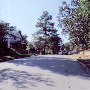Multistory houses and trees on street in residential neighborhood