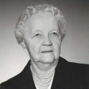 Old white woman with pearl necklaces and brooch