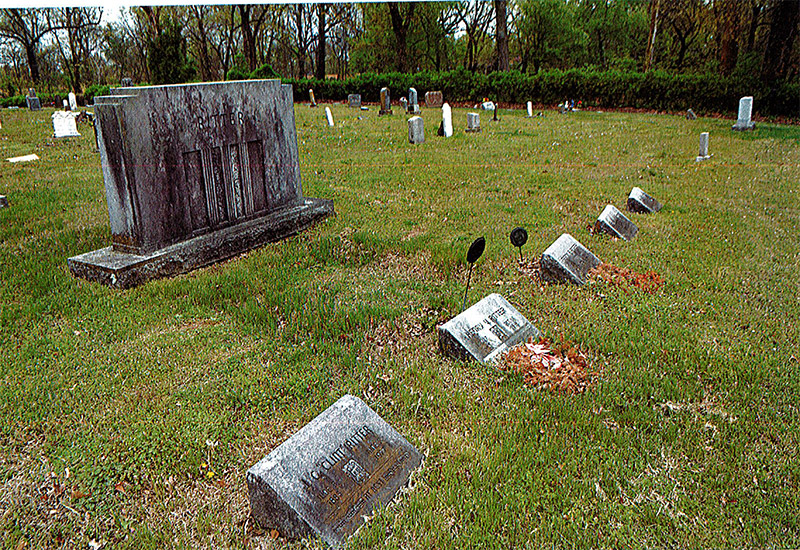 Weathered gravestones in cemetery