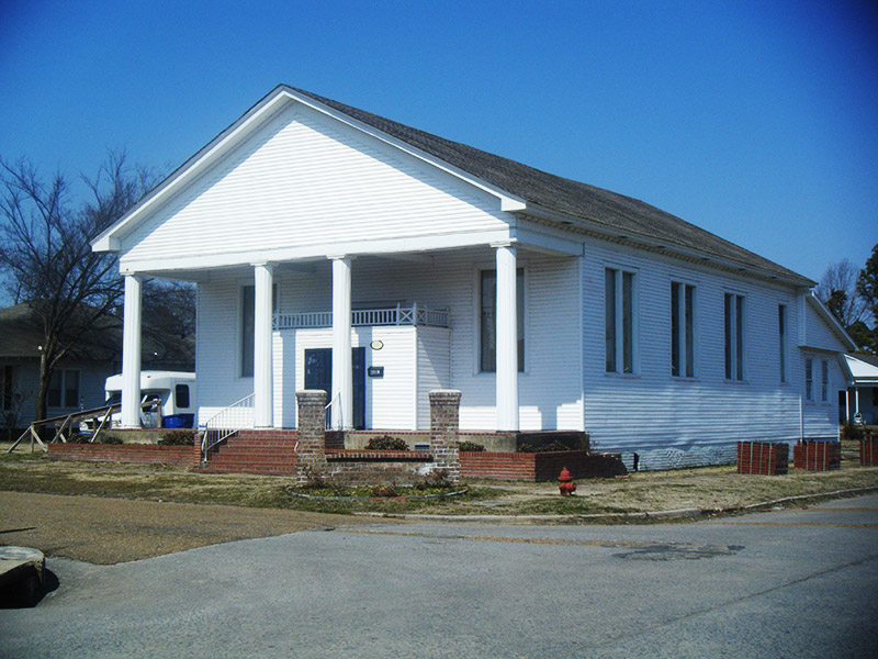 White church building with columns