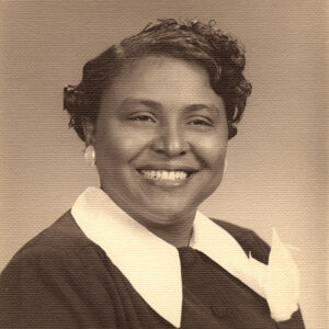 African-American woman smiling in collared top