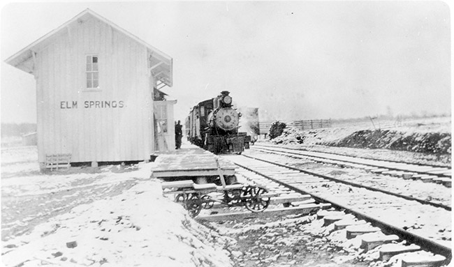 Steam locomotive at "Elm Springs" depot