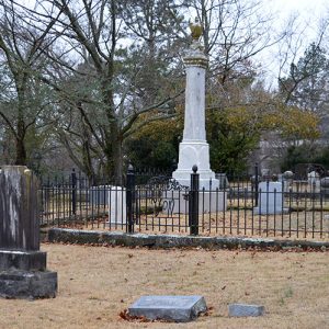 Family plot in cemetery with iron fence