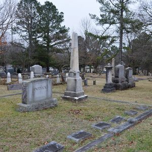 Family plots in cemetery with grave markers